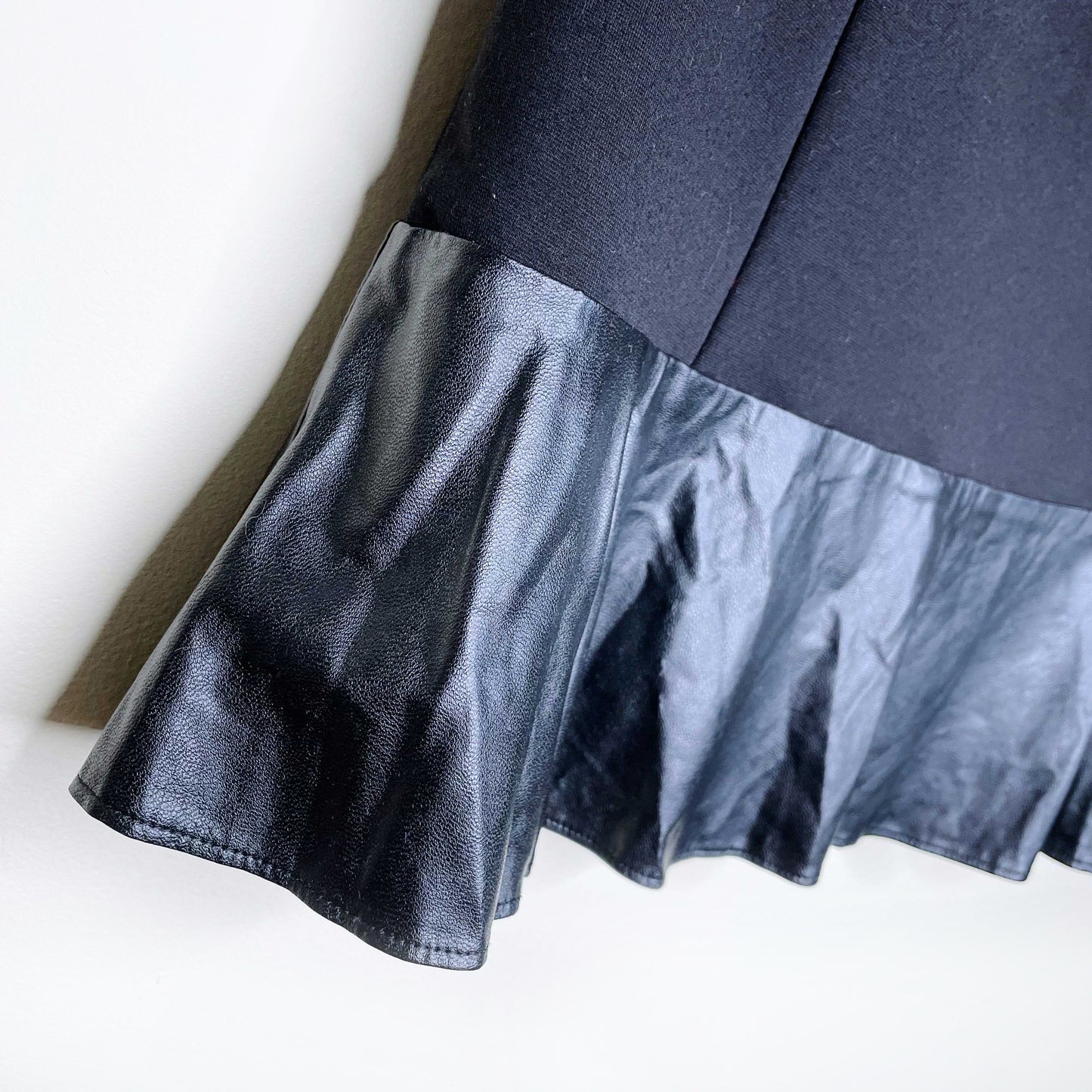 sandro black mini skirt with faux leather peplum hem - size 2